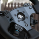 Close up on spokes and controls on Logitech G Pro steering wheel.